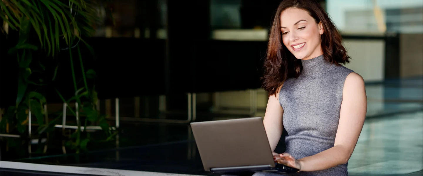 Professional reviewing workplace mental health care on a laptop