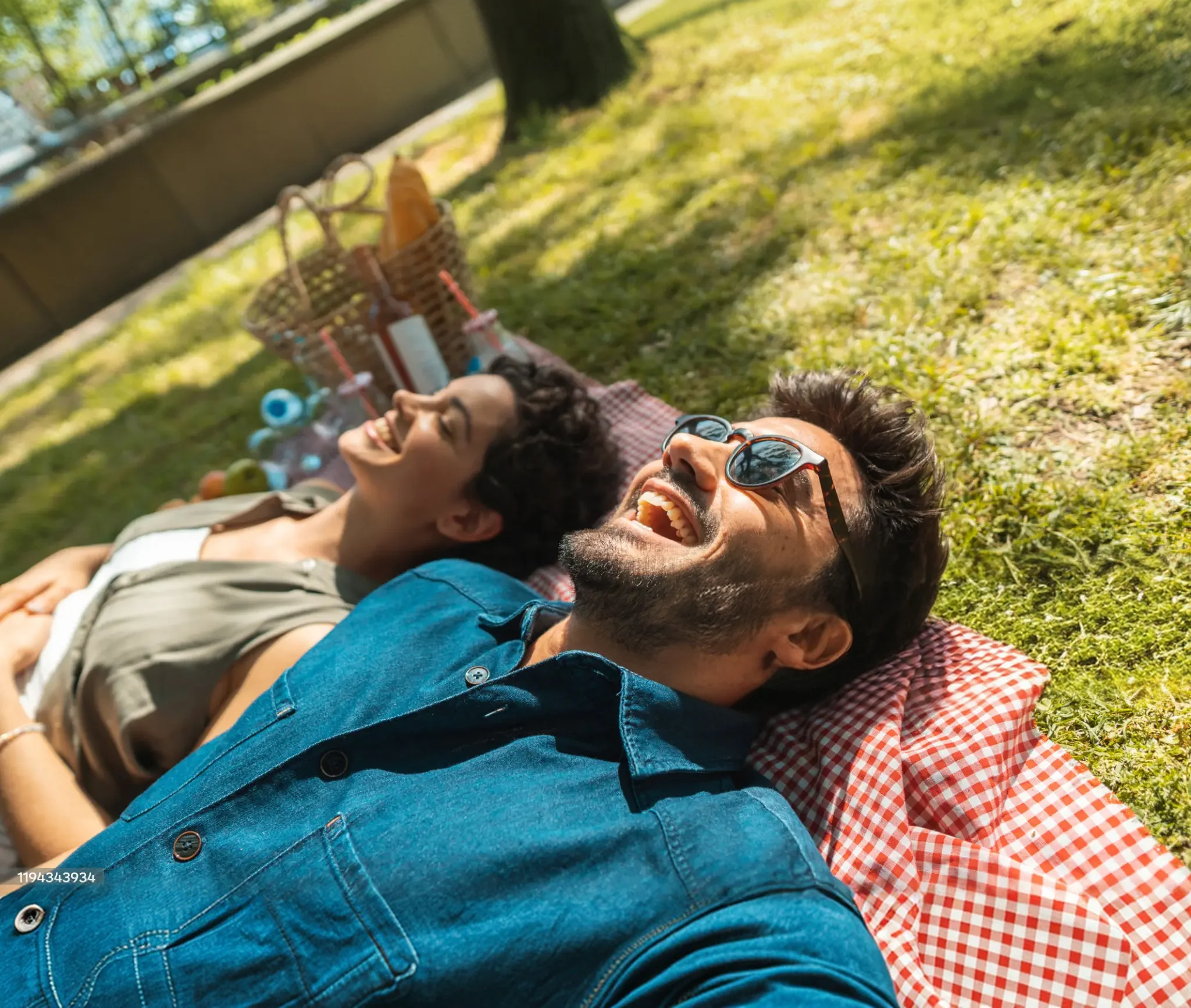 Couple relaxing together outdoors on a sunny day