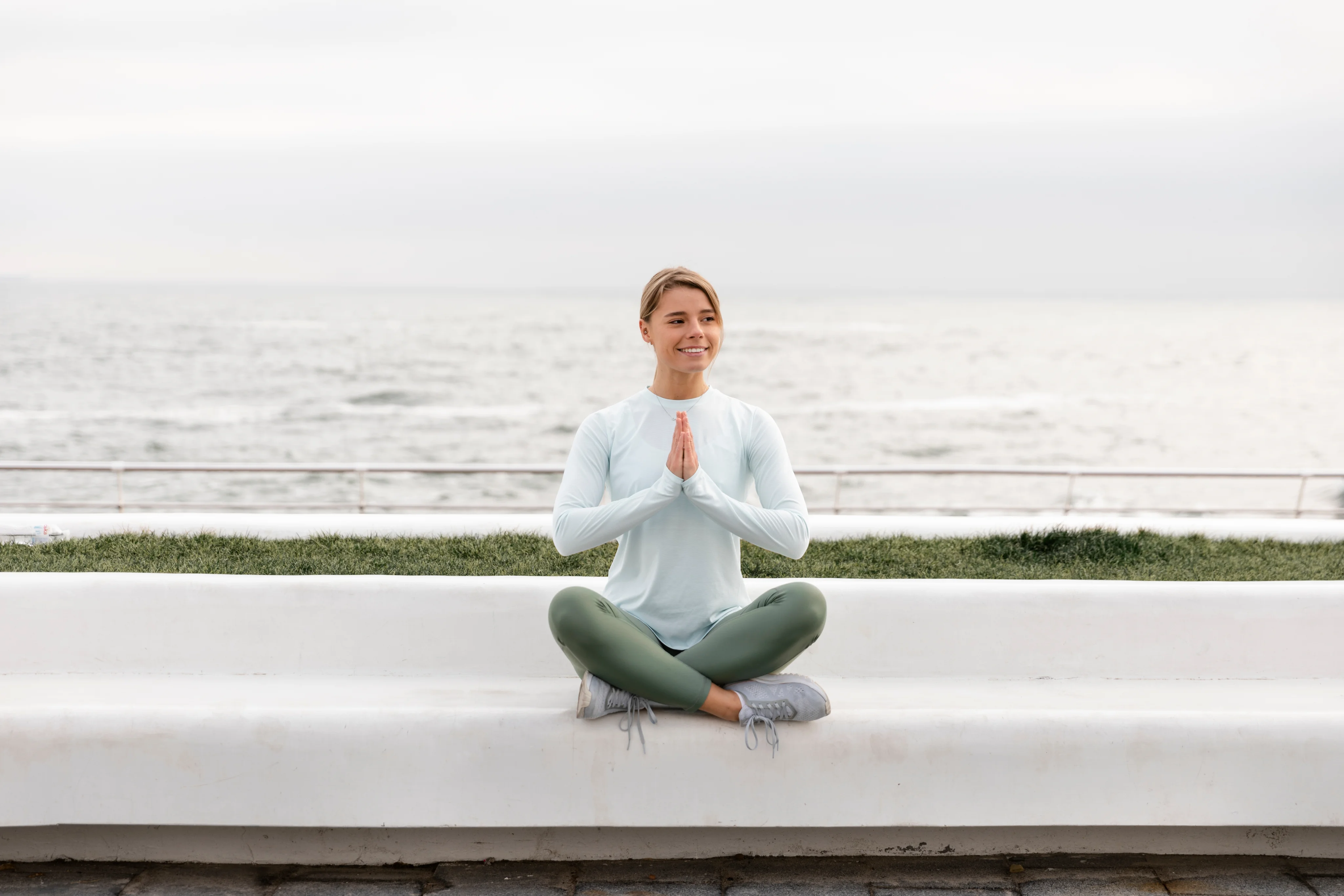 Person practicing mindfulness by the water