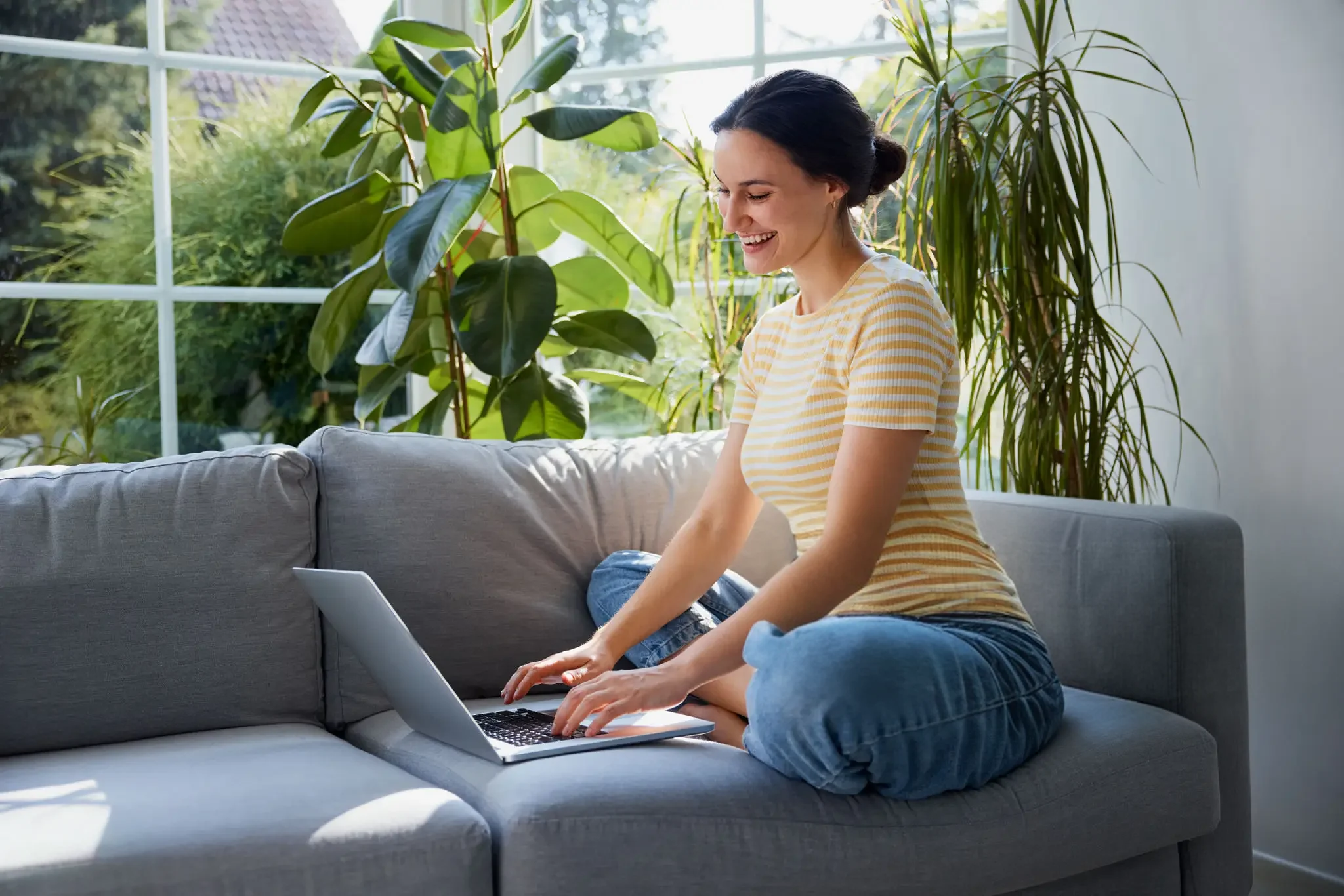 Person working comfortably from home on a laptop